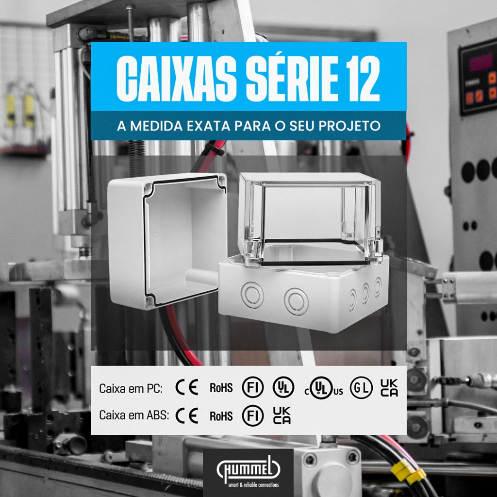 Industrial machinery with a blue banner reading 'Caixas Série 12' and a clear plastic housing piece in the foreground.