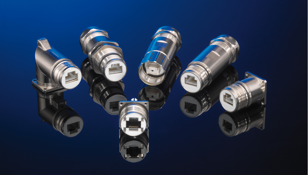 Six cylindrical metal connectors with white inner housings and rectangular sockets sit on a glossy, reflective black surface with a blue gradient background.